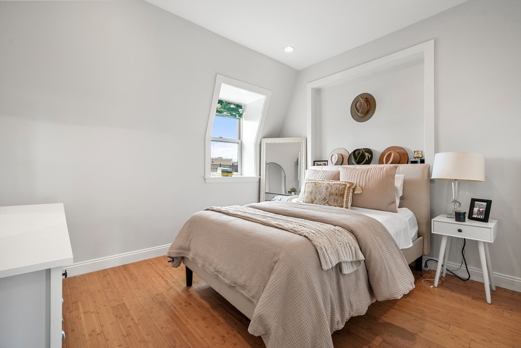 21 Worcester Square, Unit 5 Boston, MA 02118 - Photo 22 of 33 a bedroom with a bed and a window