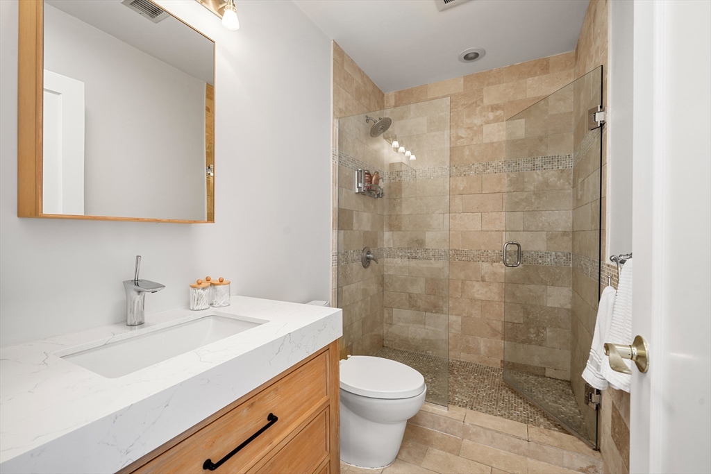 21 Worcester Square, Unit 5 Boston, MA 02118 - Photo 24 of 33 a bathroom with a sink a toilet and shower
