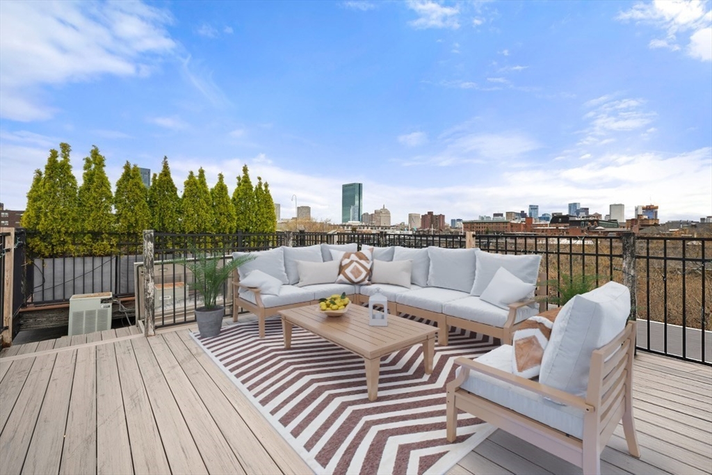 21 Worcester Square, Unit 5 Boston, MA 02118 - Photo 26 of 33 a view of a roof deck with couches