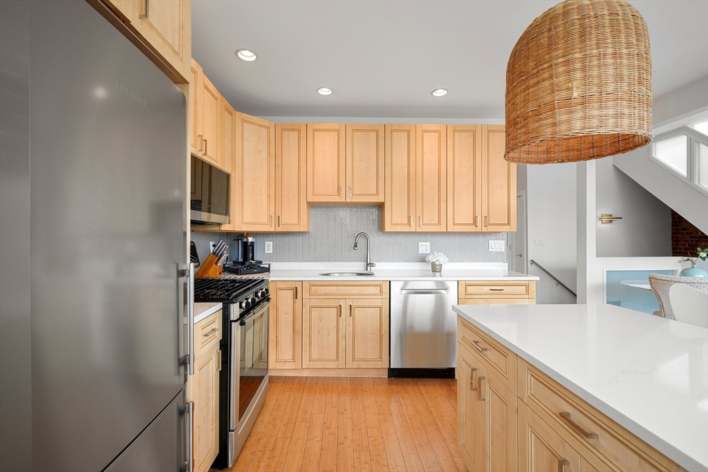 21 Worcester Square, Unit 5 Boston, MA 02118 - Photo 3 of 33 a kitchen with a sink cabinets and window