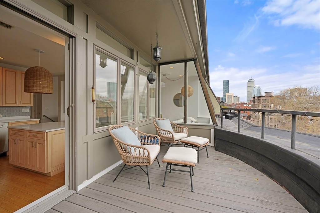 21 Worcester Square, Unit 5 Boston, MA 02118 - Photo 8 of 33 a view of a balcony with furniture and wooden floor