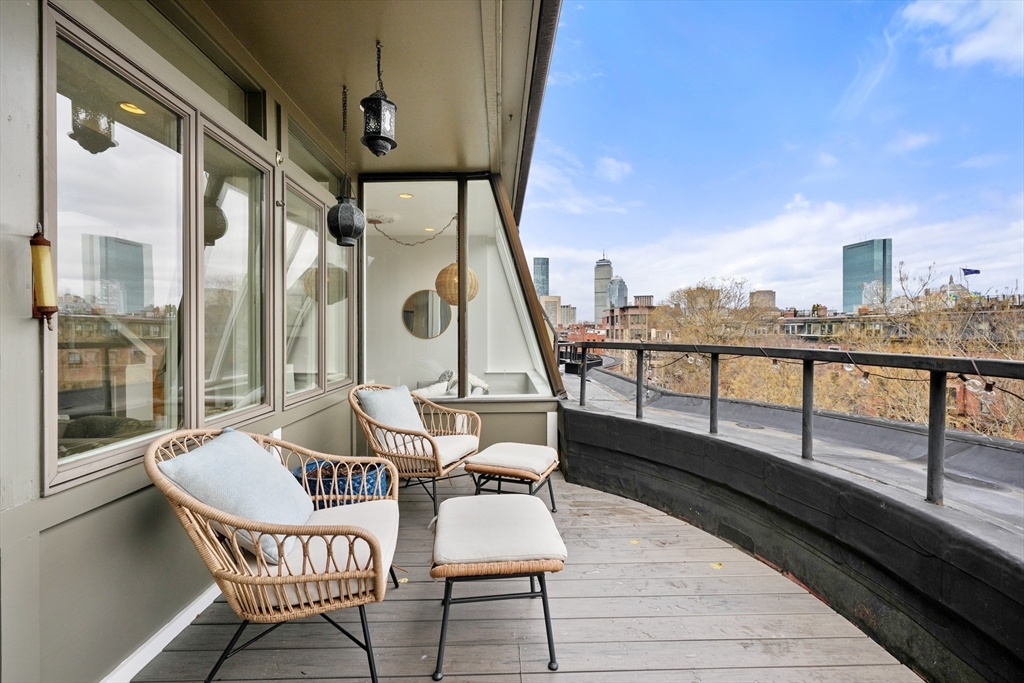21 Worcester Square, Unit 5 Boston, MA 02118 - Photo 9 of 33 a balcony with furniture and a potted plant