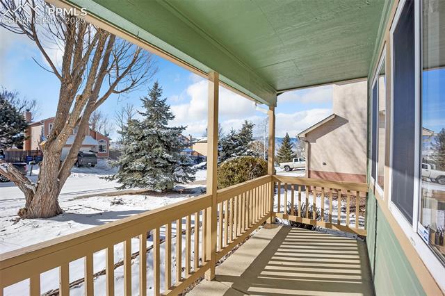 6560 Leesburg Road Colorado Springs, CO 80922 - Photo 4 of 42 Front Porch w/ Mountain Views