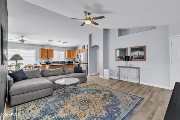 a living room with furniture and a rug