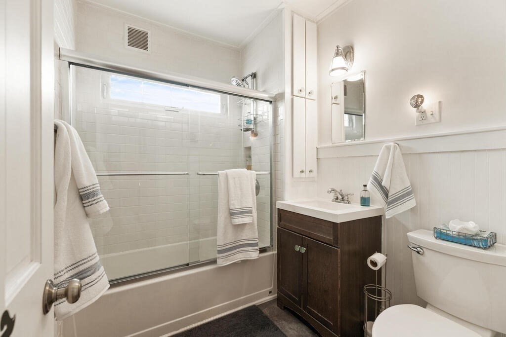 75 Puritan Road, Unit 1 Swampscott, MA 01907 - Photo 11 of 17 a bathroom with a granite countertop sink toilet and shower