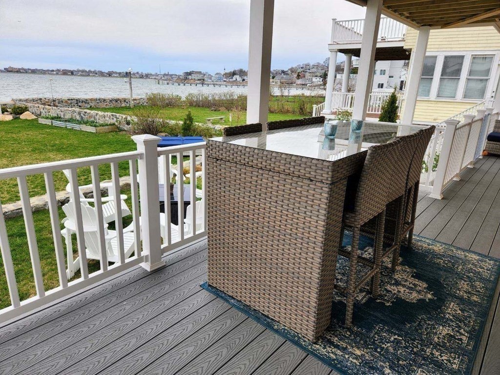 75 Puritan Road, Unit 1 Swampscott, MA 01907 - Photo 12 of 17 a balcony with table and chairs