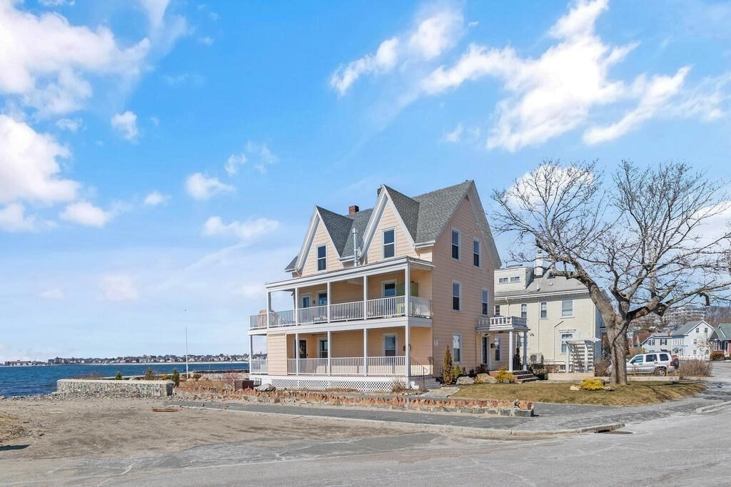 75 Puritan Road, Unit 1 Swampscott, MA 01907 - Photo 2 of 17 a view of a building with a street