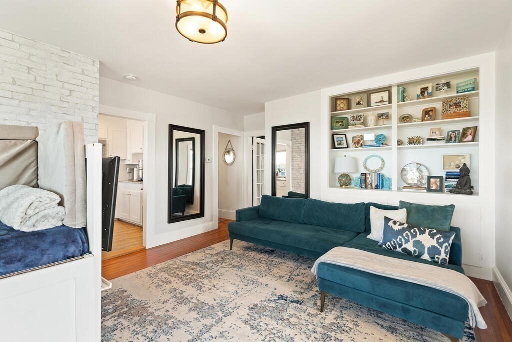 75 Puritan Road, Unit 1 Swampscott, MA 01907 - Photo 7 of 17 a living room with furniture and a rug