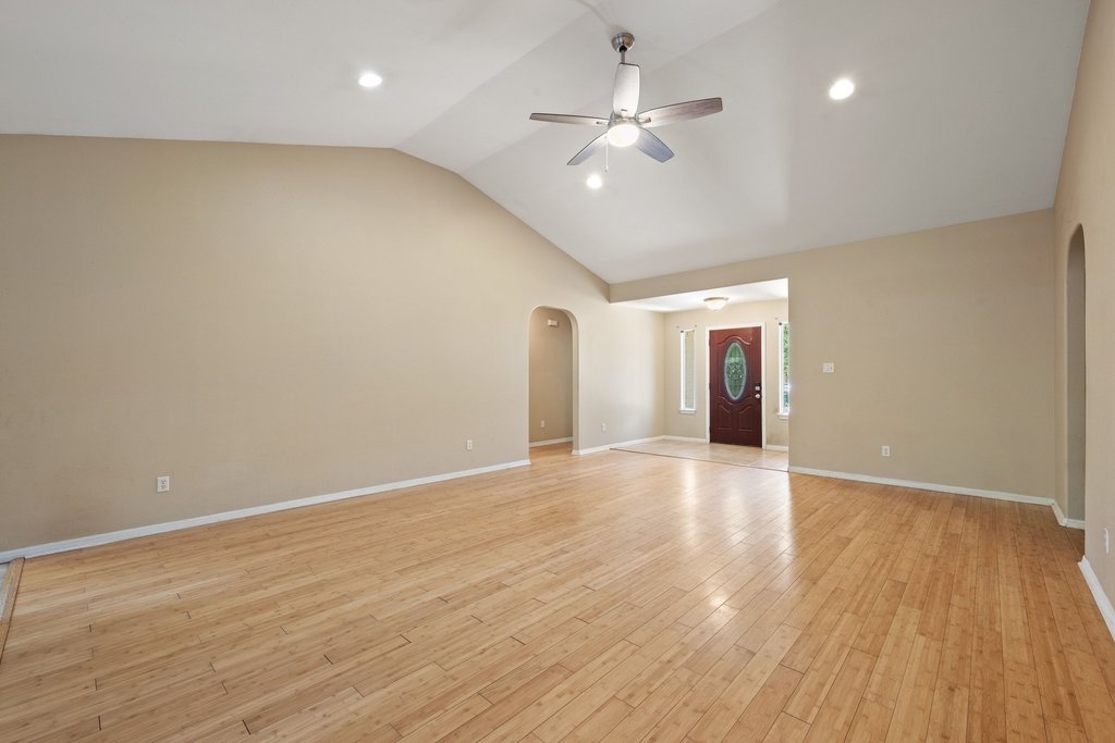 5208 Sioux Lane Austin, TX 78734 - Photo 13 of 35 Natural illumination highlights the wide-plank wood flooring throughout this welcoming main living area.