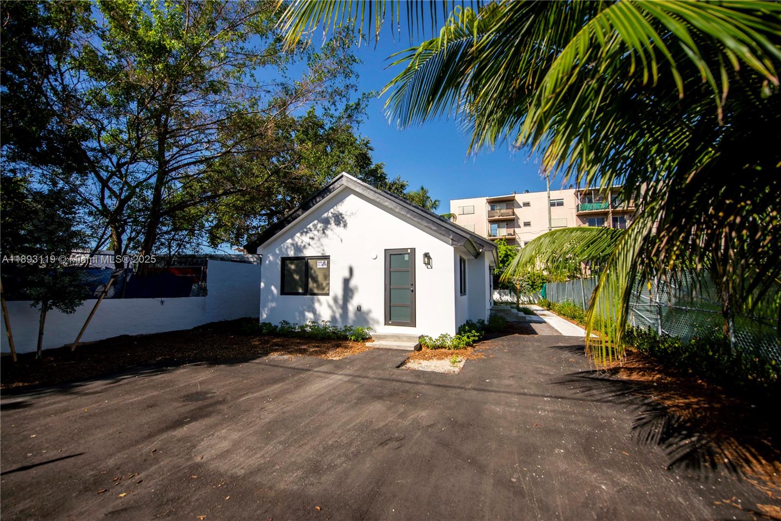 764 Northwest 36th Avenue, Unit 2 Miami, FL 33125 - Photo 1 of 11 a view of a house with a yard