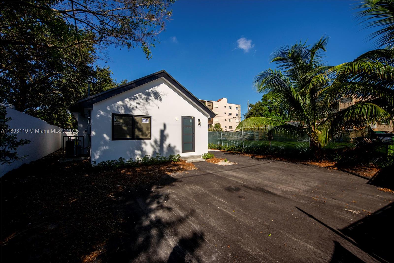 764 Northwest 36th Avenue, Unit 2 Miami, FL 33125 - Photo 2 of 11 a view of a house with backyard and garden