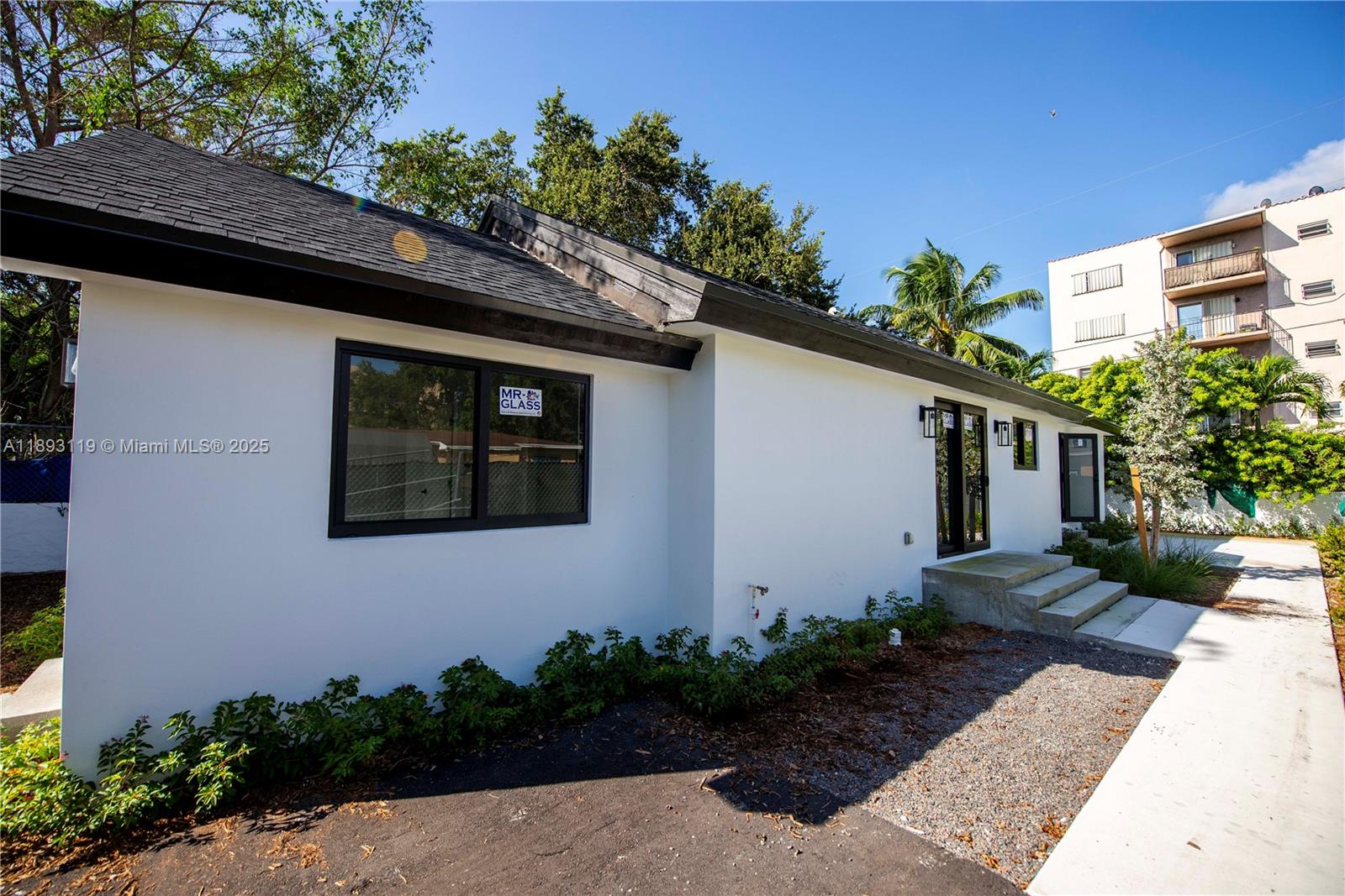 764 Northwest 36th Avenue, Unit 2 Miami, FL 33125 - Photo 9 of 11 a front view of a house with garden
