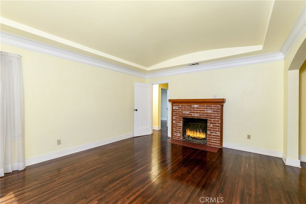 9959 Garibaldi Avenue Arcadia, CA 91007 - Photo 12 of 51 a view of a livingroom with wooden floor and a fireplace