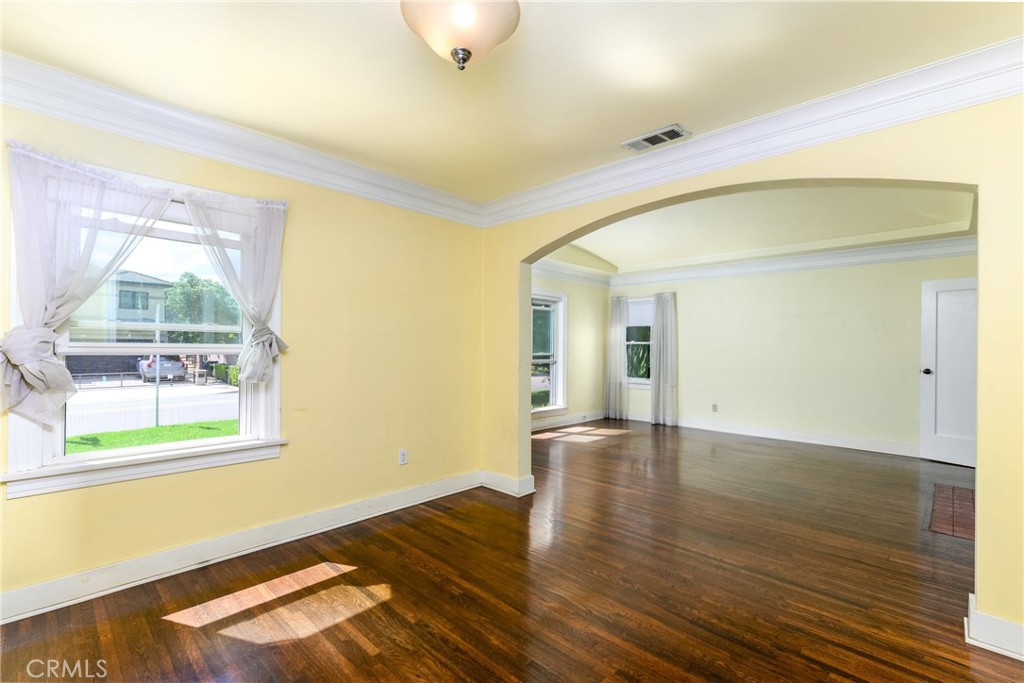 9959 Garibaldi Avenue Arcadia, CA 91007 - Photo 14 of 51 an empty room with wooden floor and windows