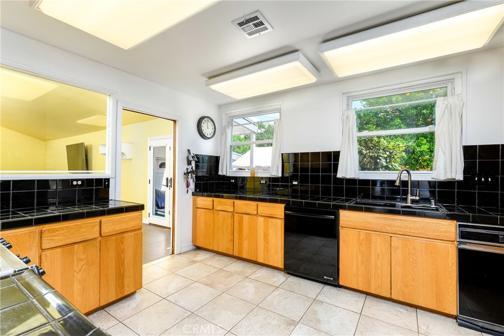 9959 Garibaldi Avenue Arcadia, CA 91007 - Photo 16 of 51 a kitchen with stainless steel appliances granite countertop a sink and a stove