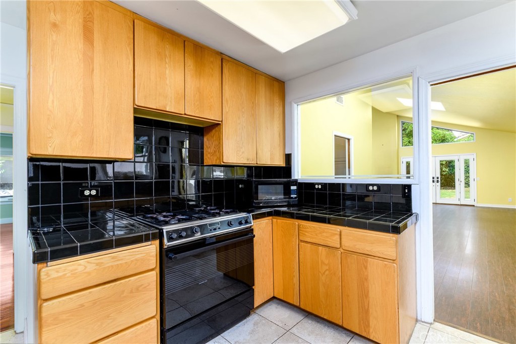 9959 Garibaldi Avenue Arcadia, CA 91007 - Photo 18 of 51 a kitchen with granite countertop a stove and a sink