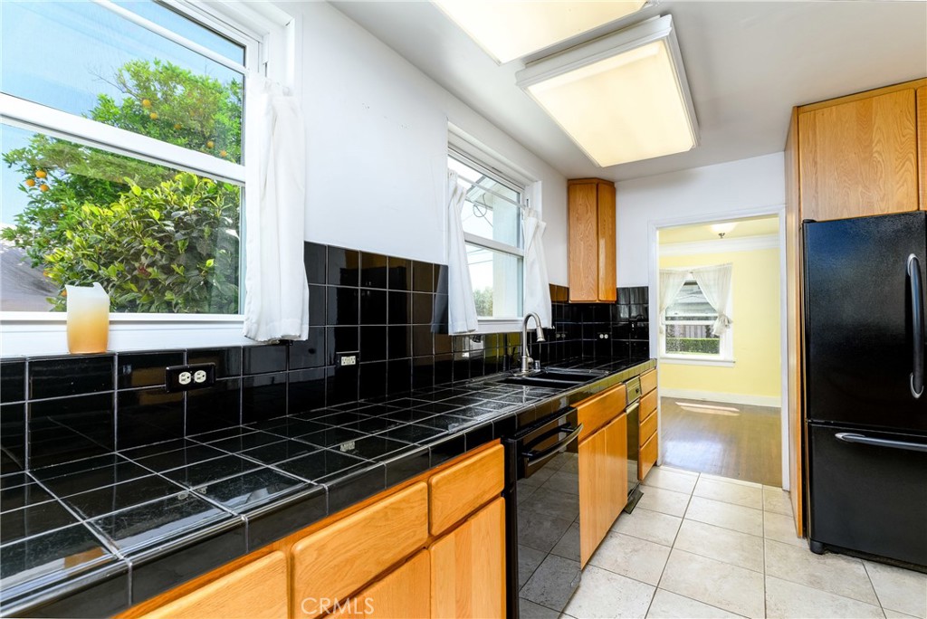 9959 Garibaldi Avenue Arcadia, CA 91007 - Photo 19 of 51 a kitchen with stainless steel appliances a sink stove and refrigerator