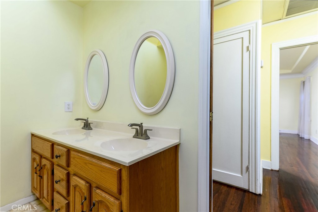 9959 Garibaldi Avenue Arcadia, CA 91007 - Photo 27 of 51 a bathroom with a sink and a mirror