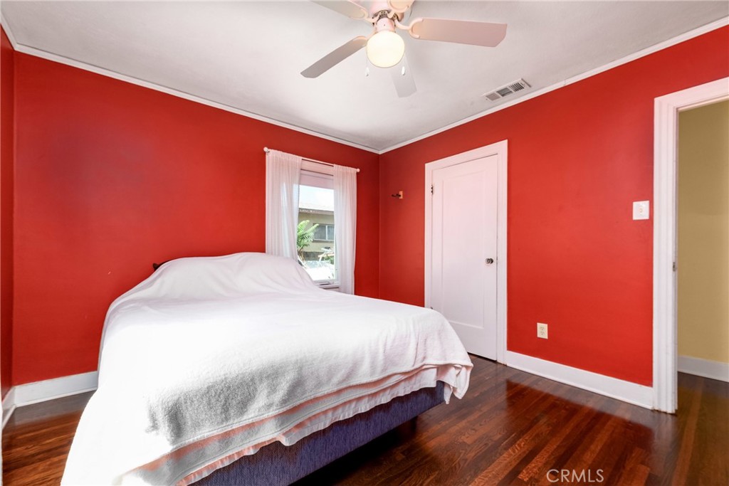 9959 Garibaldi Avenue Arcadia, CA 91007 - Photo 32 of 51 a bedroom with a large bed and a chandelier