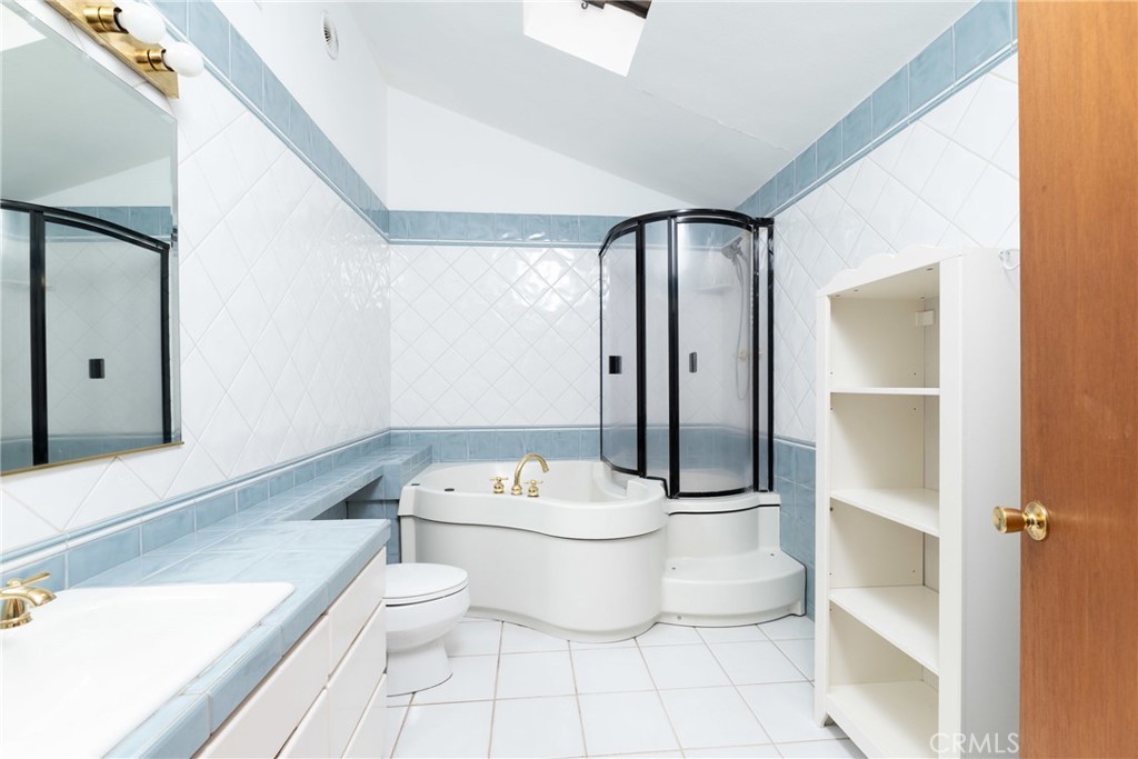 9959 Garibaldi Avenue Arcadia, CA 91007 - Photo 39 of 51 a bathroom with a toilet a sink and shower
