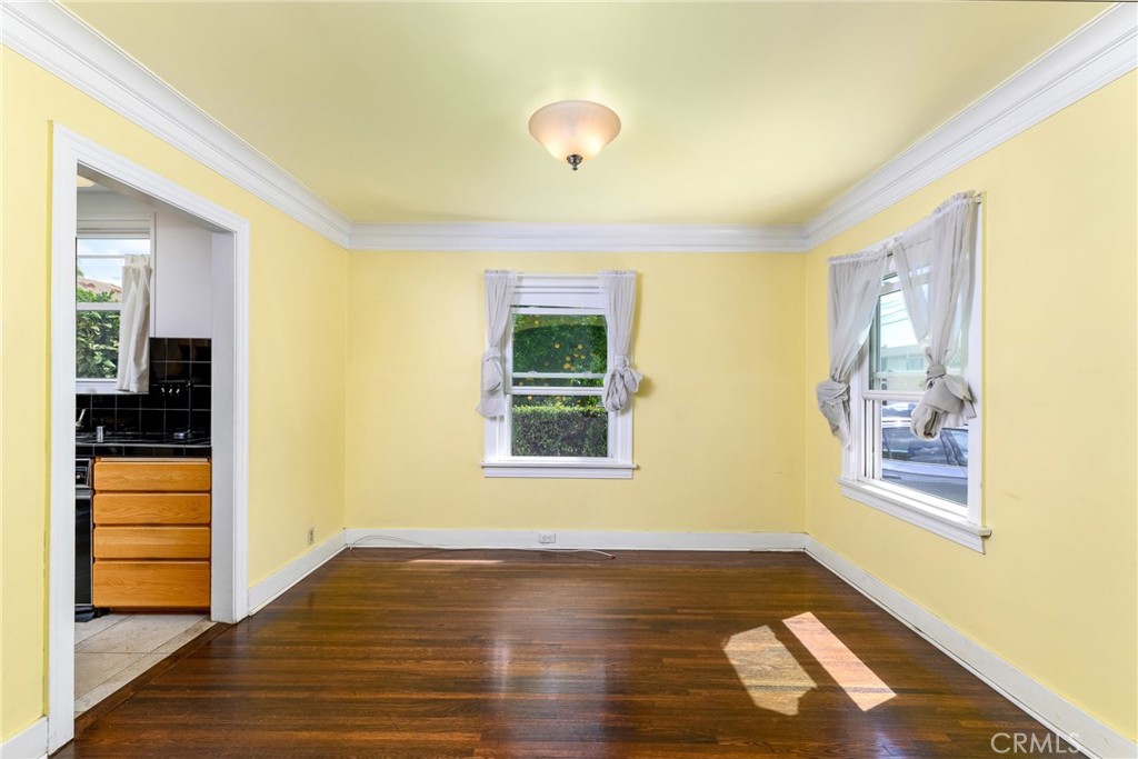 9959 Garibaldi Avenue Arcadia, CA 91007 - Photo 8 of 51 a view of an empty room with wooden floor and a window