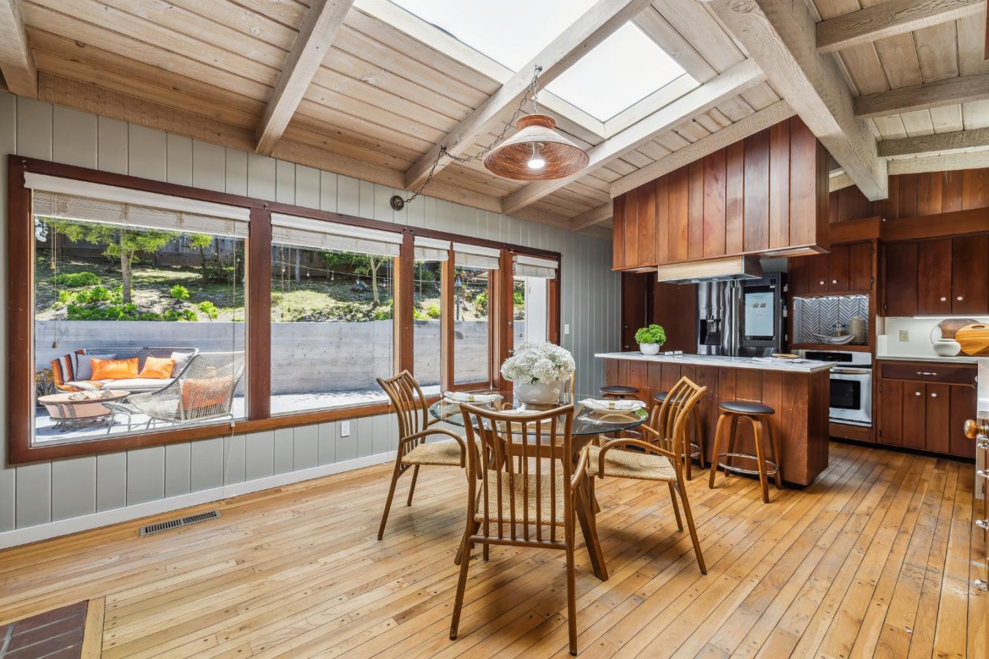 25165 Stewart Place Carmel, CA 93923 - Photo 13 of 51 a view of a dining room with furniture window and wooden floor