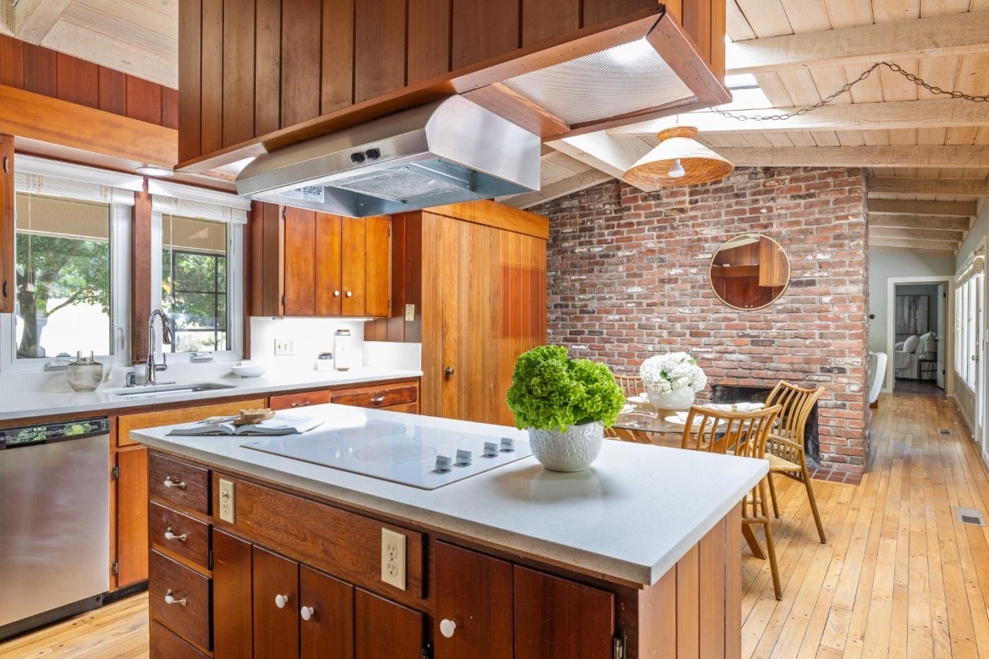 25165 Stewart Place Carmel, CA 93923 - Photo 16 of 51 a kitchen with a sink a stove and a cabinets