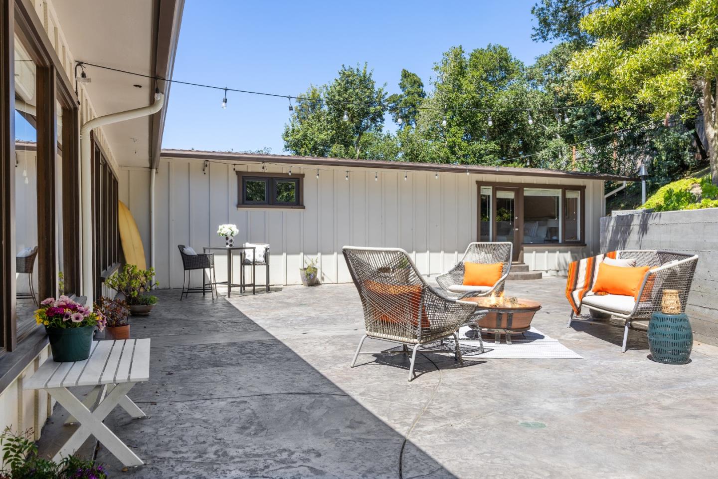 25165 Stewart Place Carmel, CA 93923 - Photo 18 of 51 a view of a patio with table and chairs potted plants with wooden fence