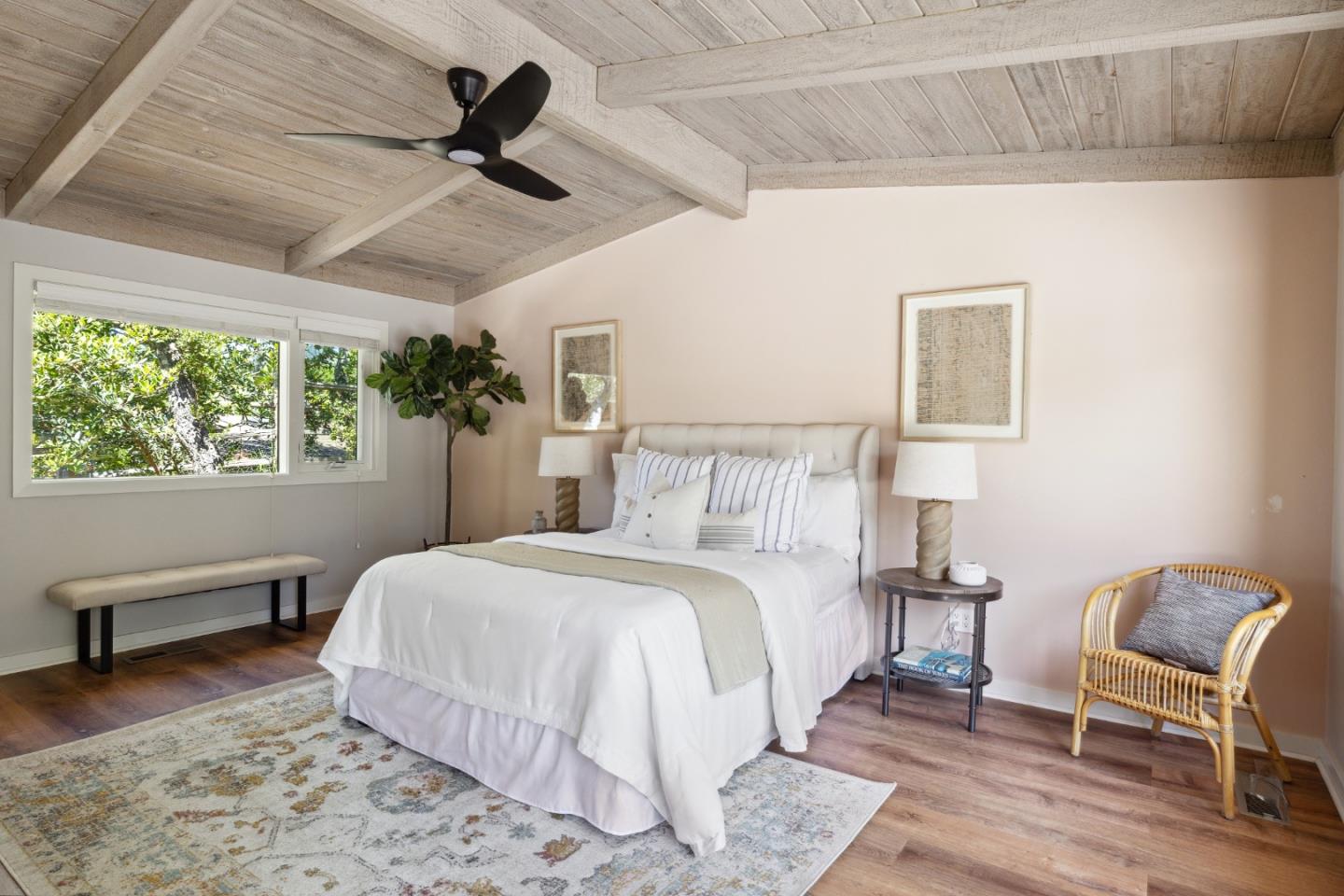 25165 Stewart Place Carmel, CA 93923 - Photo 22 of 51 a bedroom with a bed a chair and potted plant on the dresser