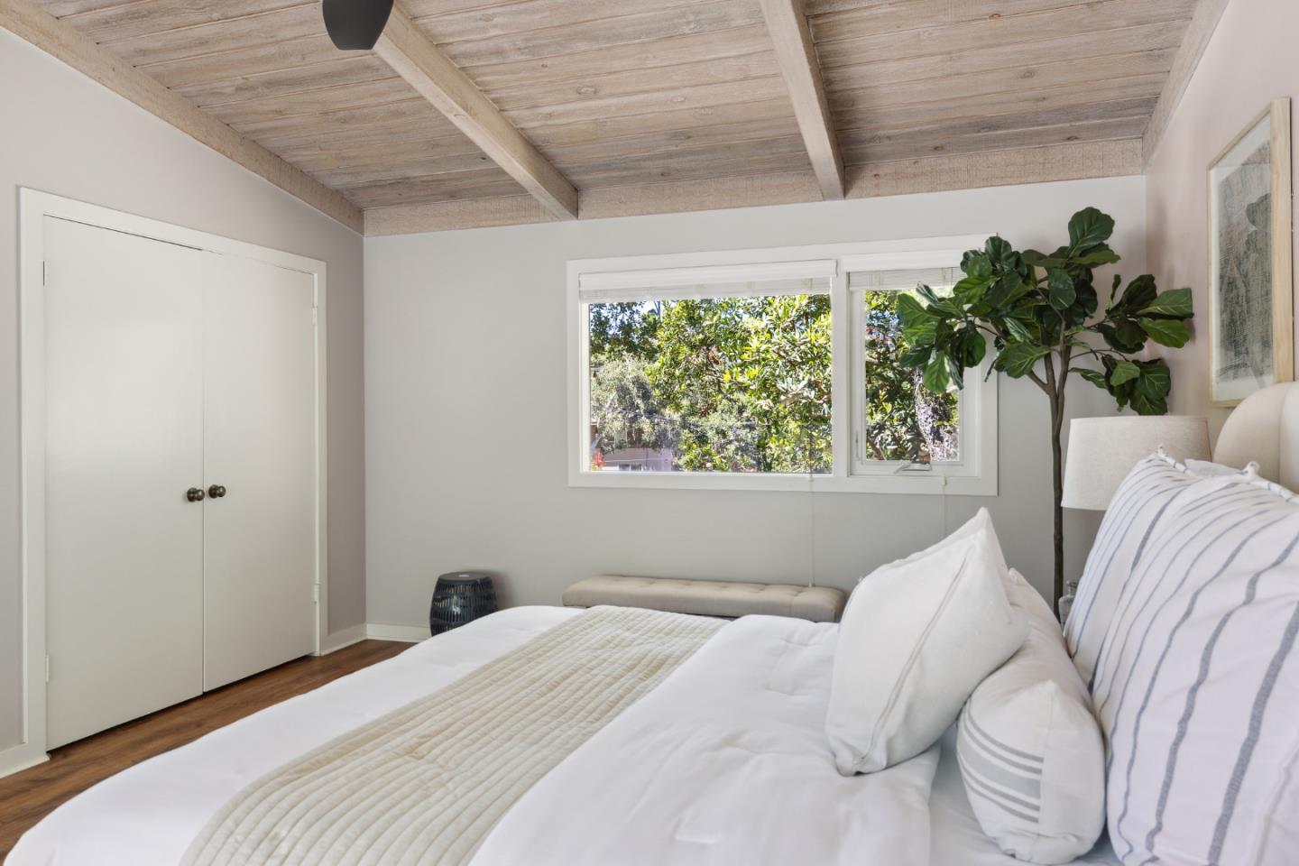 25165 Stewart Place Carmel, CA 93923 - Photo 24 of 51 a bedroom with a bed and a window