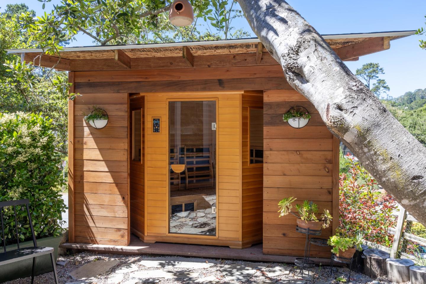 25165 Stewart Place Carmel, CA 93923 - Photo 29 of 51 a front view of a house with a tree