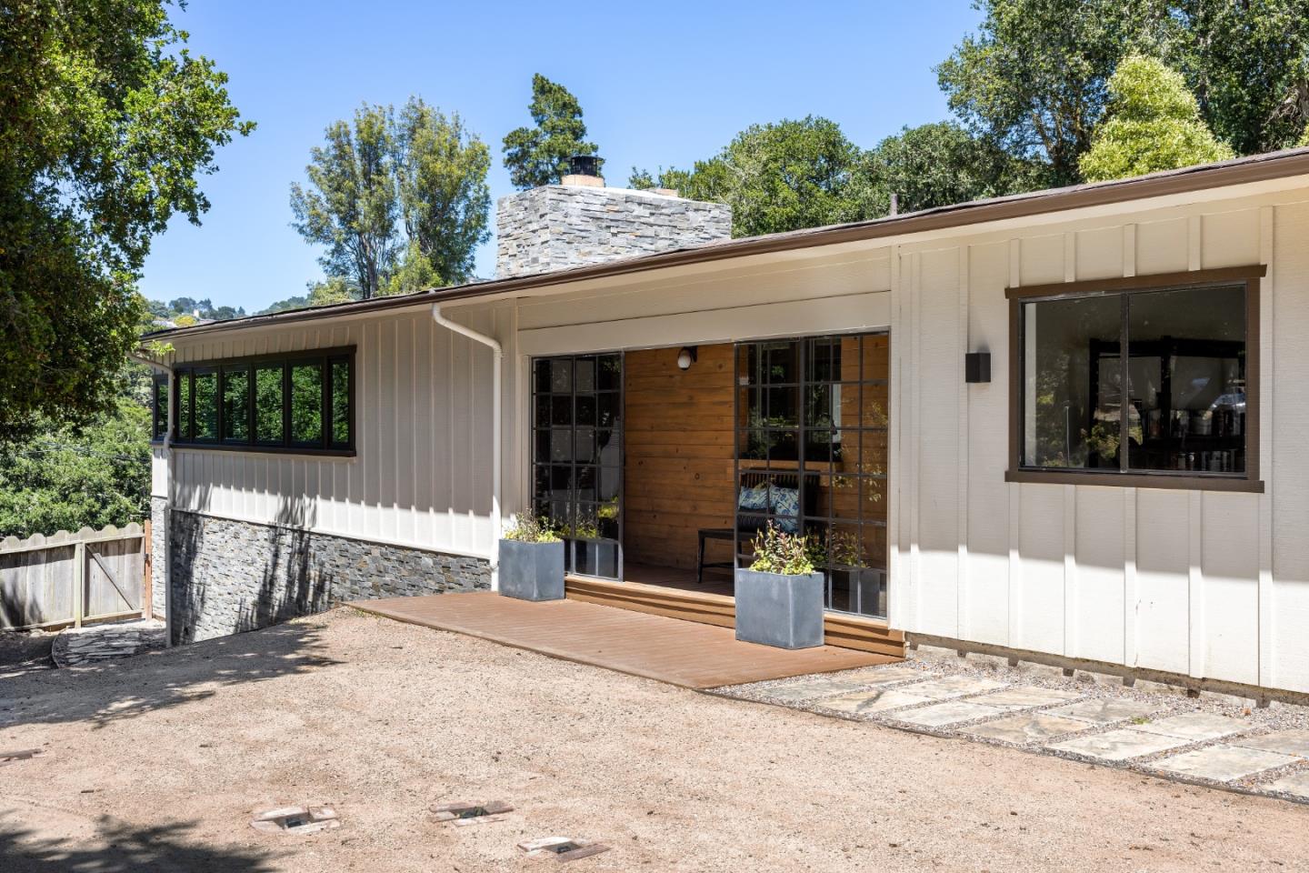 25165 Stewart Place Carmel, CA 93923 - Photo 3 of 51 front view of a house with a patio