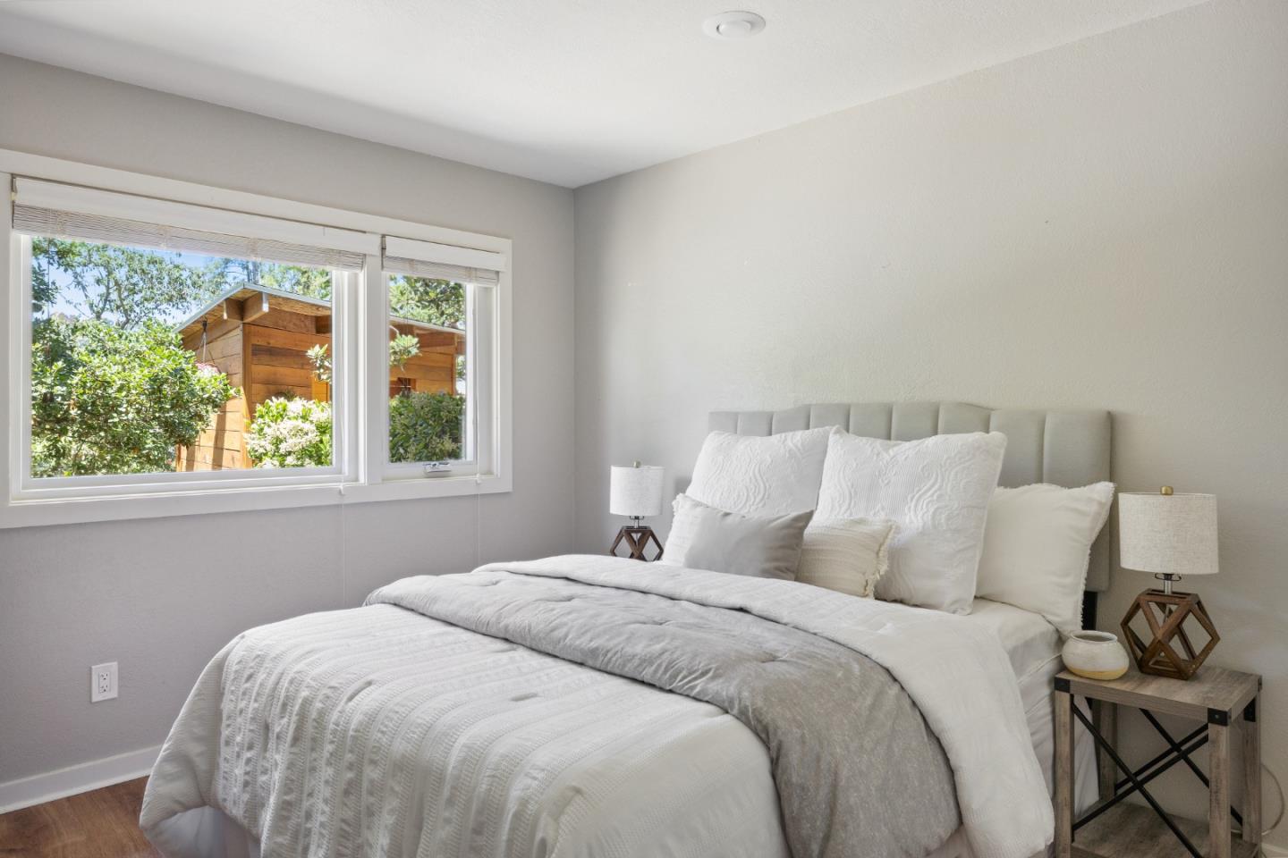 25165 Stewart Place Carmel, CA 93923 - Photo 31 of 51 a bedroom with a bed and a window