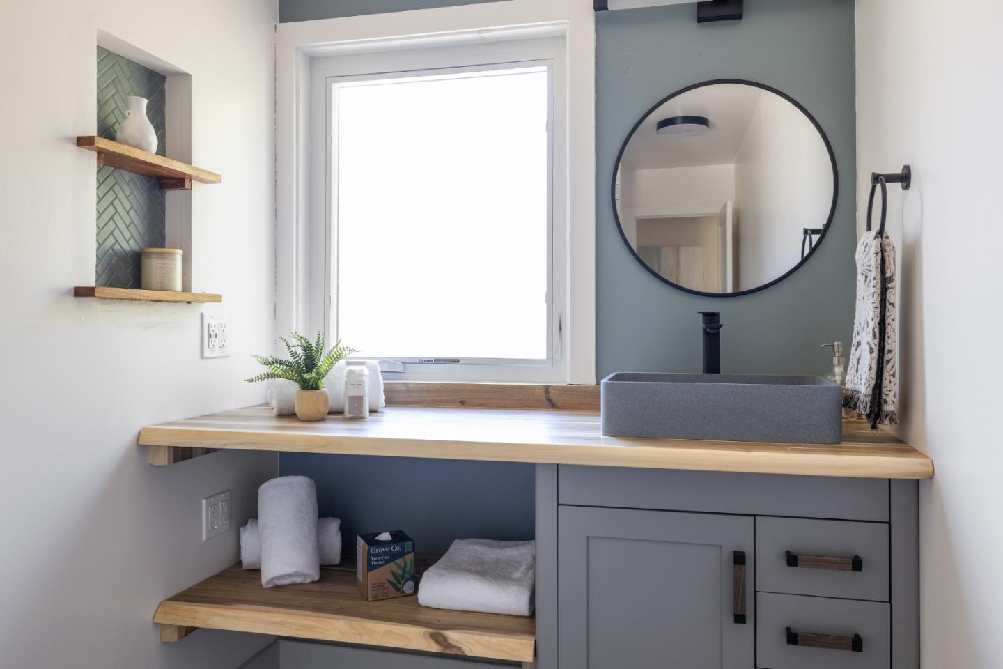 25165 Stewart Place Carmel, CA 93923 - Photo 34 of 51 a bathroom with a sink and a mirror