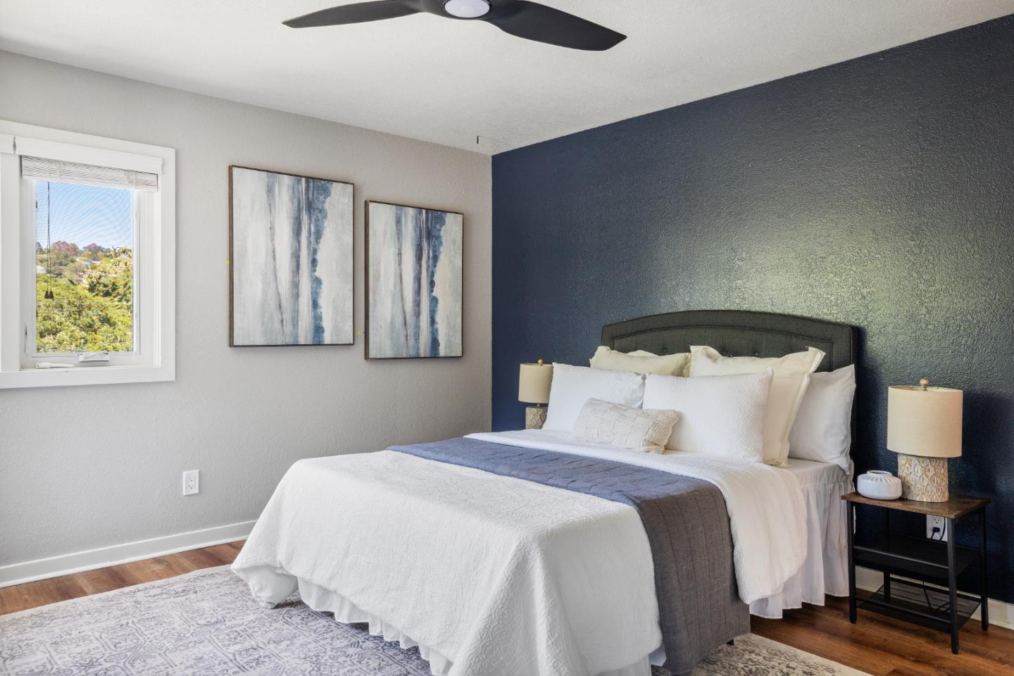 25165 Stewart Place Carmel, CA 93923 - Photo 36 of 51 a bedroom with a bed and lamps