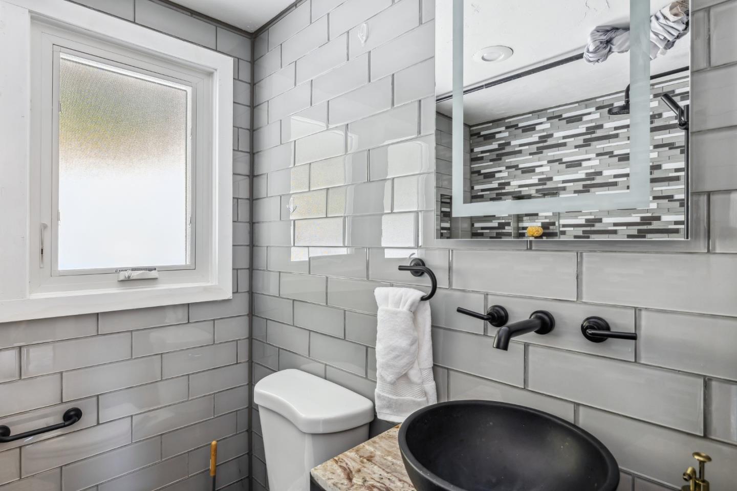 25165 Stewart Place Carmel, CA 93923 - Photo 38 of 51 a bathroom with a toilet and a sink