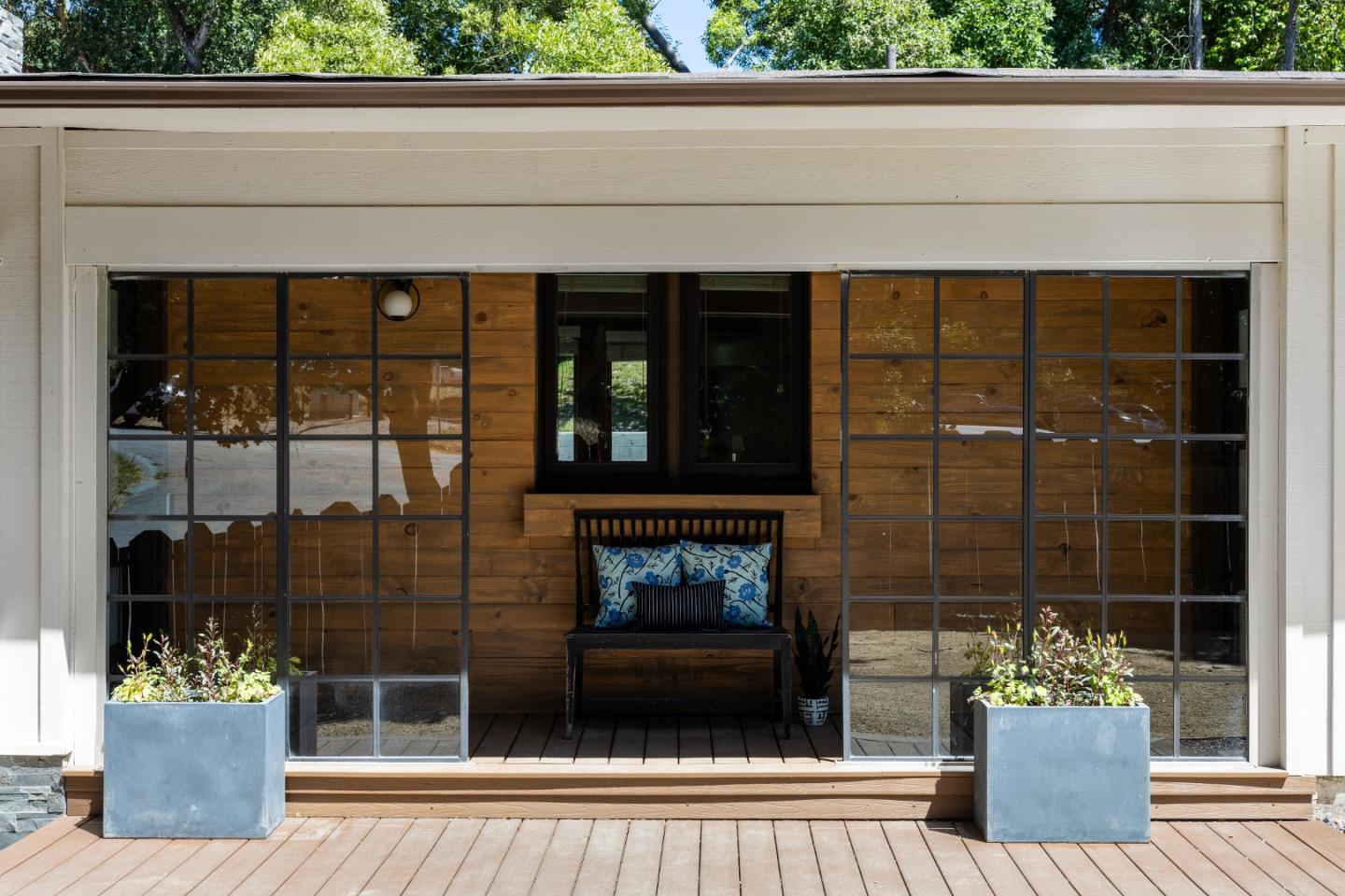 25165 Stewart Place Carmel, CA 93923 - Photo 4 of 51 a living room with a fireplace and a potted plant