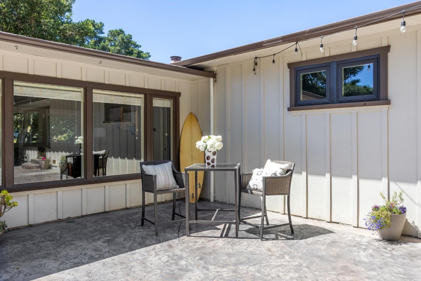 25165 Stewart Place Carmel, CA 93923 - Photo 42 of 51 a view of a porch with chairs and table in a patio