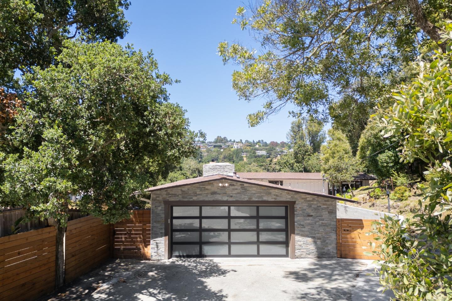25165 Stewart Place Carmel, CA 93923 - Photo 48 of 51 a front view of a house with a garden