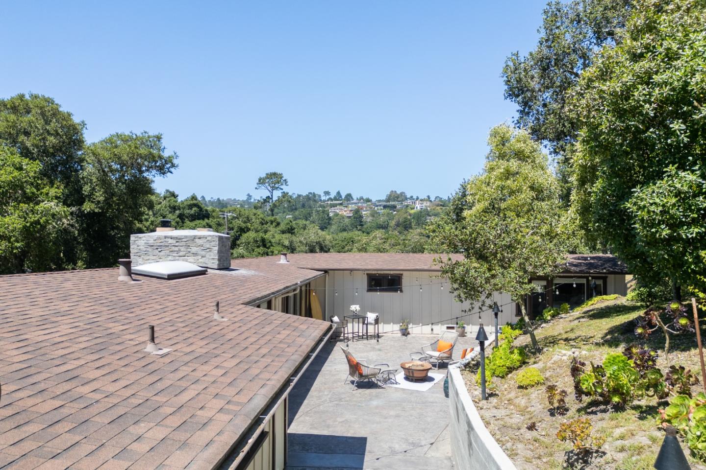 25165 Stewart Place Carmel, CA 93923 - Photo 49 of 51 a patio with table and chairs and potted plants