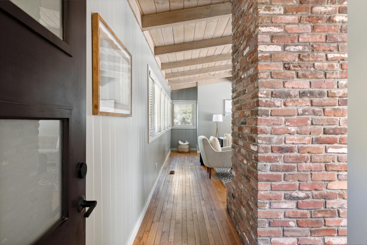 25165 Stewart Place Carmel, CA 93923 - Photo 6 of 51 a view of a brick house with wooden floor