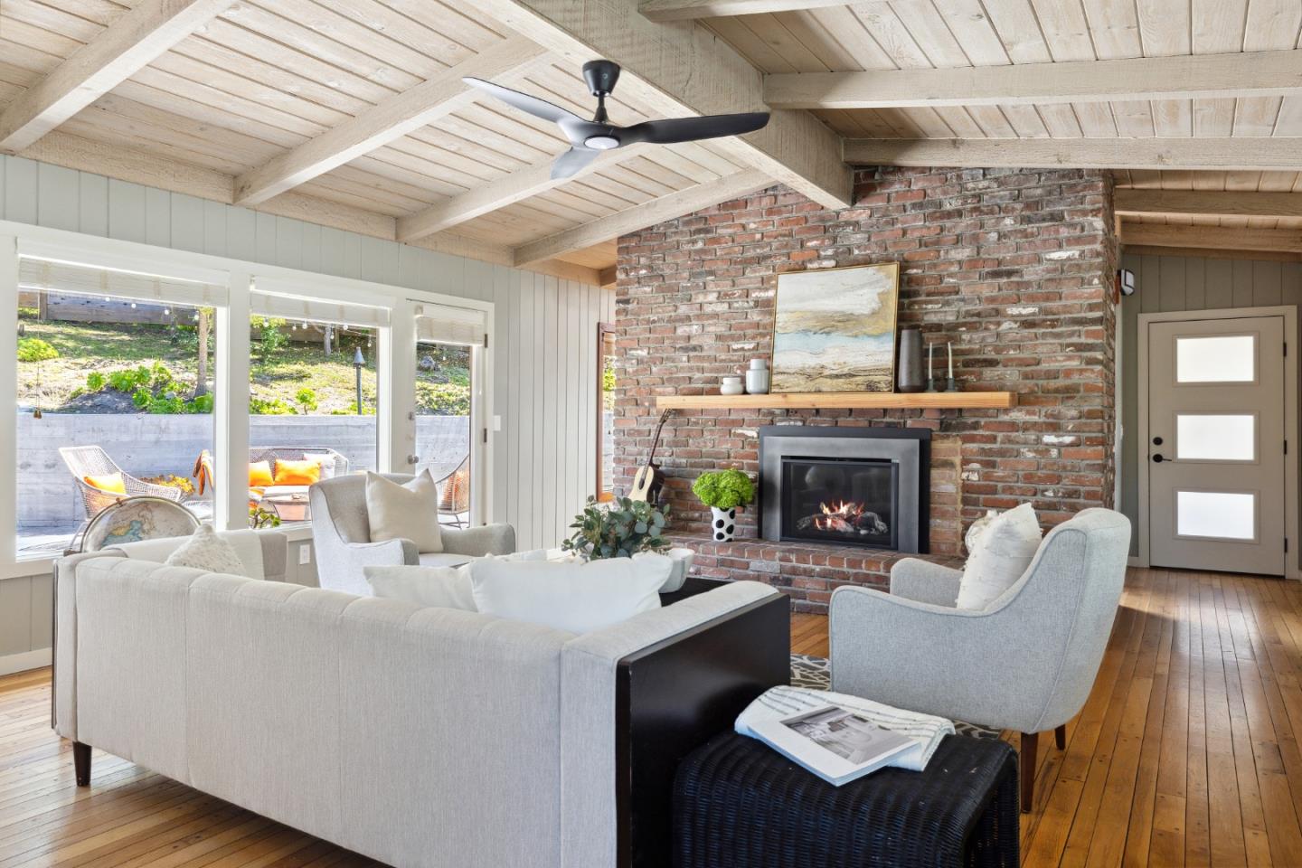 25165 Stewart Place Carmel, CA 93923 - Photo 9 of 51 a living room with furniture and a fireplace