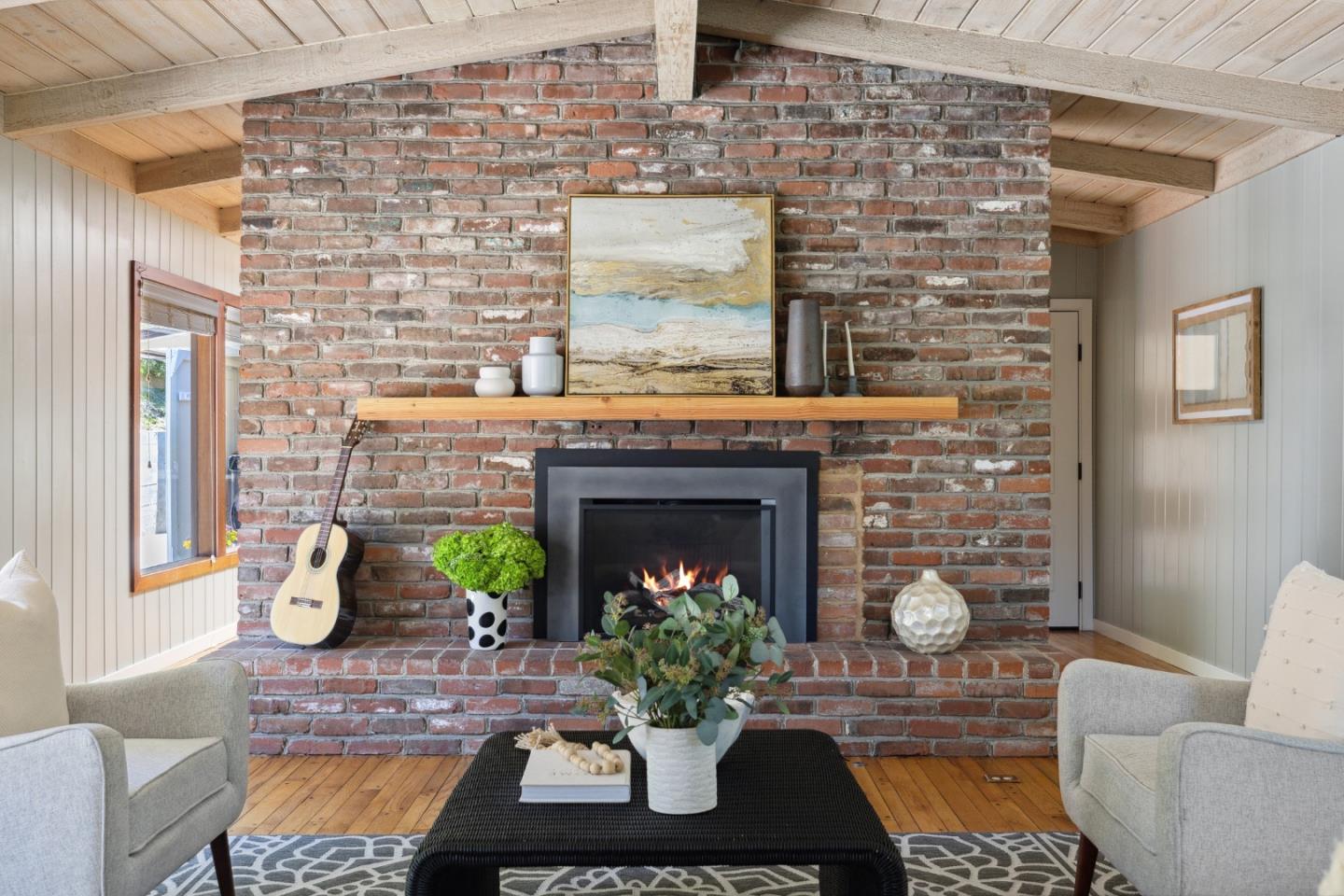 25165 Stewart Place Carmel, CA 93923 - Photo 10 of 51 a living room with furniture and a fireplace