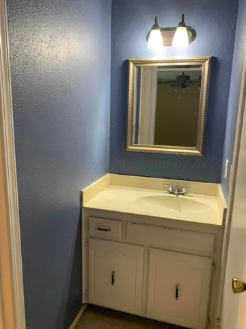 a bathroom with a sink and mirror