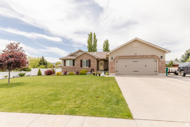 972 West 2840th Street South Logan, UT 84321 - Photo 1 of 46 Exterior featuring a brick and siding facade with a two-car garage