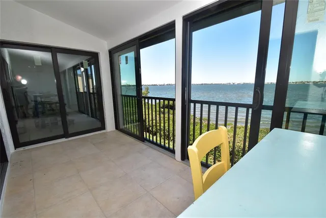 a view of a living room and balcony