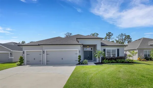front view of a house with a yard