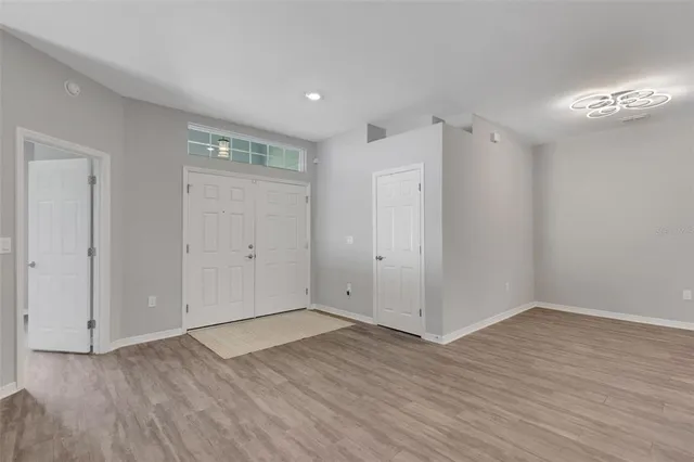 a living room with furniture and a lamp