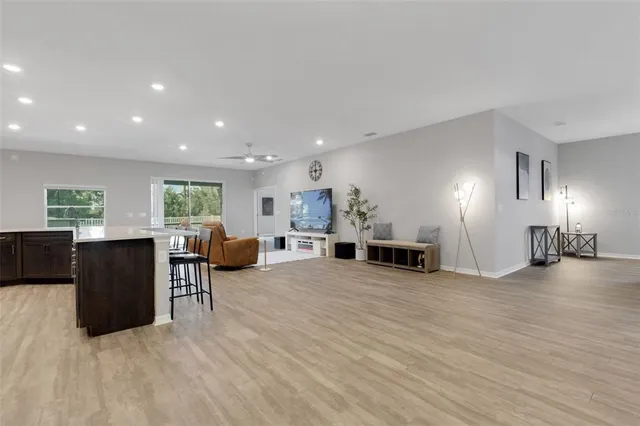 a view of a kitchen with furniture and a large window