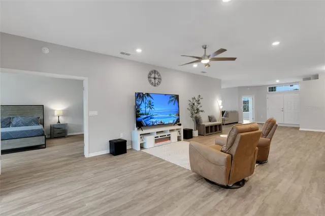 a large kitchen with stainless steel appliances lots of counter space and a refrigerator